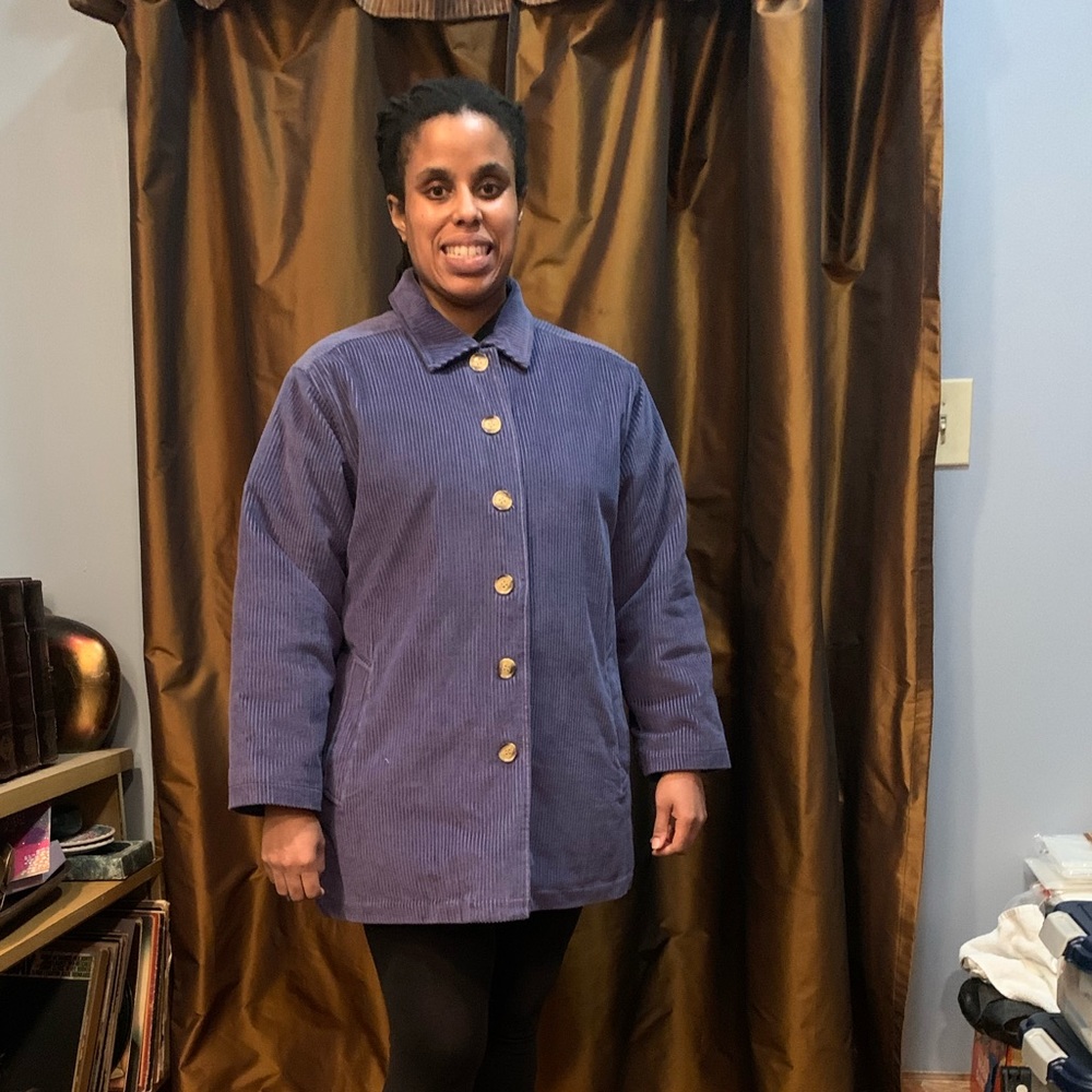 Apple seeds woman’s blue corduroy jacket
